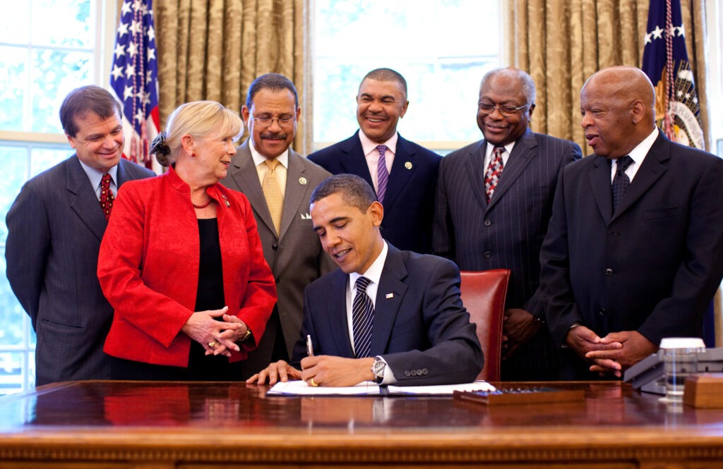 President Barack Obama signs the Civil Rights History Project Act of 2009 bill into law, John Lewis attends